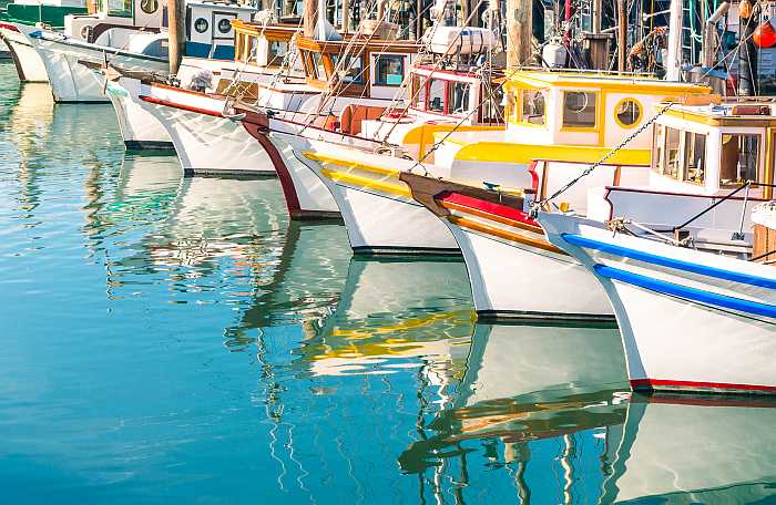 Colorful sailing boats at Fisherman's Wharf in San Francisco (Photo: Envato)