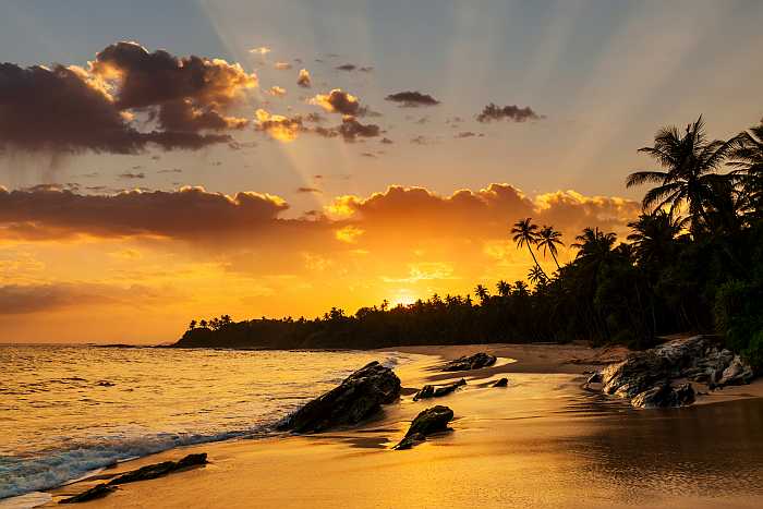 Sunset on the beach in the Caribbean (Photo: Envato)