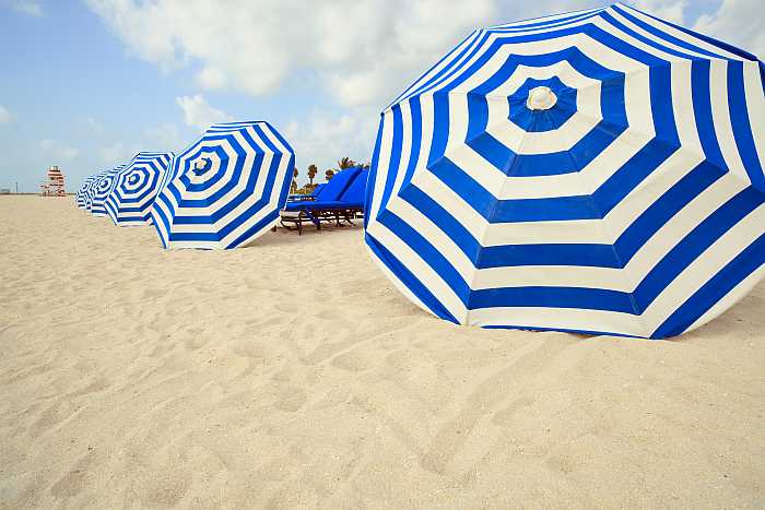 Umbrellas and lounge chairs on the beach in Miami Beach, Florida 