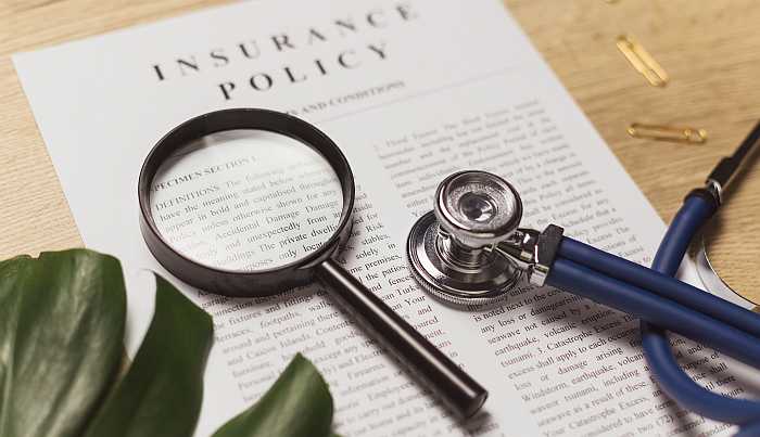 Read the fine print of travel insurance policies (Photo: Envato)