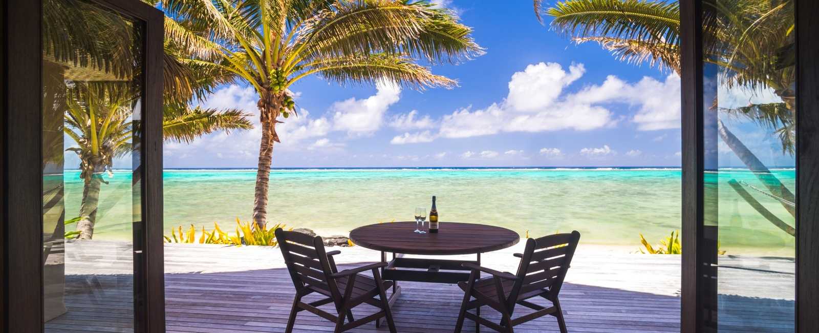 Luxury kosher-friendly beachfront vacation rental with private terrace overlooking turquoise ocean