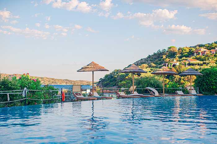 Family resort pool with mountains in the background
