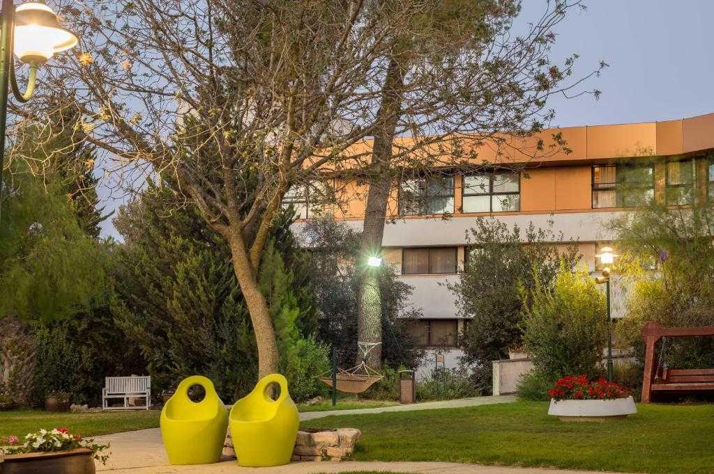 Neve Ilan Hotel surrounded by gardens and scenic Judean Hills