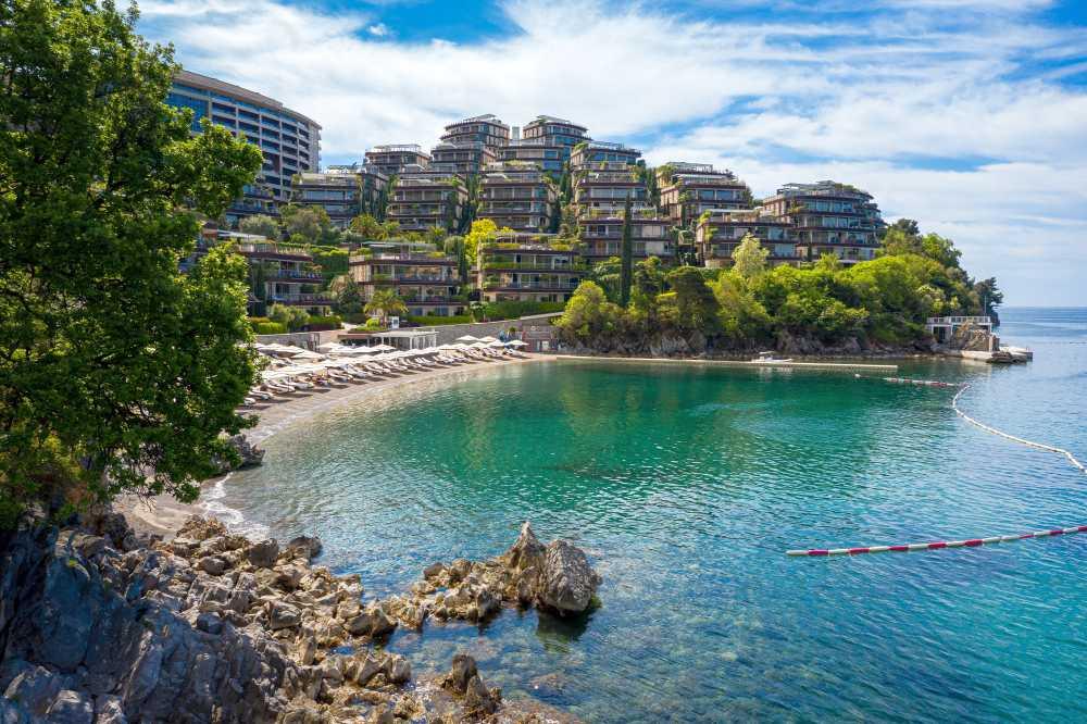 Aerial view of Dukley Hotel & Resort nestled in lush greenery along the coast