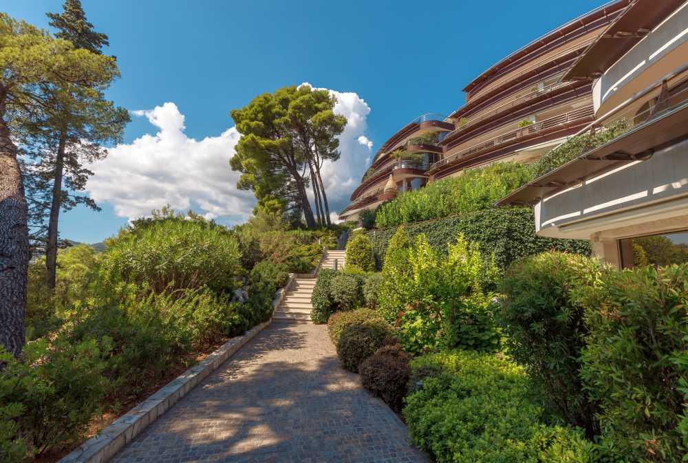 Aerial view of Dukley Hotel & Resort nestled in lush greenery along the coast